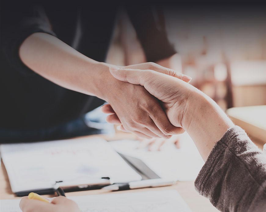 A friendly handshake at the conference