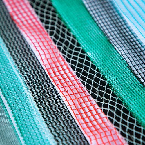 Net samples in different colors and knitting methods